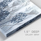 Close-up view of wrapped canvas corner featuring indigo floral abstraction.