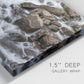 Close-up view of wrapped canvas corner featuring rushing river water over rocks.