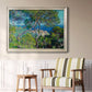 Impressionist Mediterranean coastal landscape by Claude Monet in an ornate champagne frame displayed in a light-toned interior setting.
