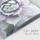 Close-up view of wrapped canvas corner featuring close up succulent photography.