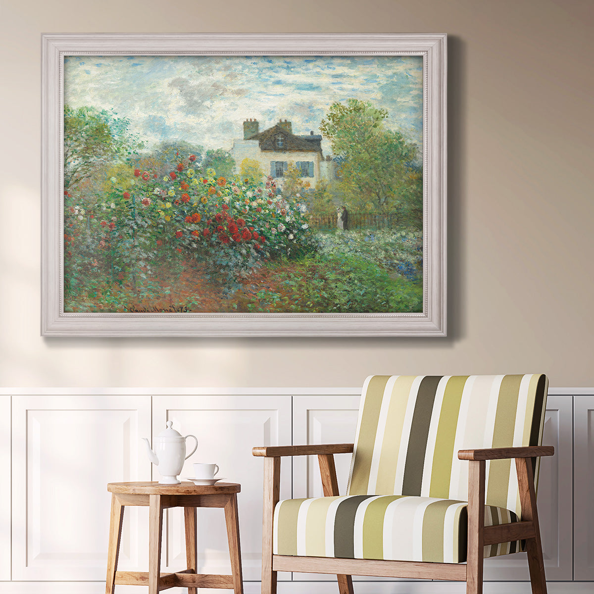 Impressionist garden landscape at Argenteuil by Claude Monet in an ornate weathered white frame displayed in a light-toned interior setting.