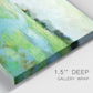 Close-up view of wrapped canvas corner featuring gentle stream winding through trees.