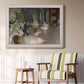 Impressionist backstage ballet scene by Edgar Degas in an ornate weathered white frame displayed in a light-toned interior setting.