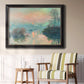 Impressionist winter river sunset scene by Claude Monet in an ornate black frame with gilded inner detail displayed in a light-toned interior setting.