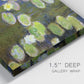 Close-up view of wrapped canvas corner featuring yellow and white water lilies.