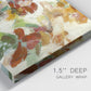 Close-up view of wrapped canvas corner featuring layered floral botanical impressions.