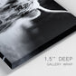 Close-up view of wrapped canvas corner featuring black and white cattle portrait.
