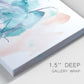 Close-up view of wrapped canvas corner featuring soft abstract watercolor forms.