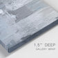 Close-up view of wrapped canvas corner featuring cool toned industrial abstract blues.