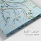 Close-up view of wrapped canvas corner featuring blue sky with flowering branches.