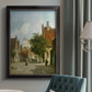 Rustic European street scene painting by Adriaan Eversen in an {frame_style_descriptor} displayed in a neutral interior setting.