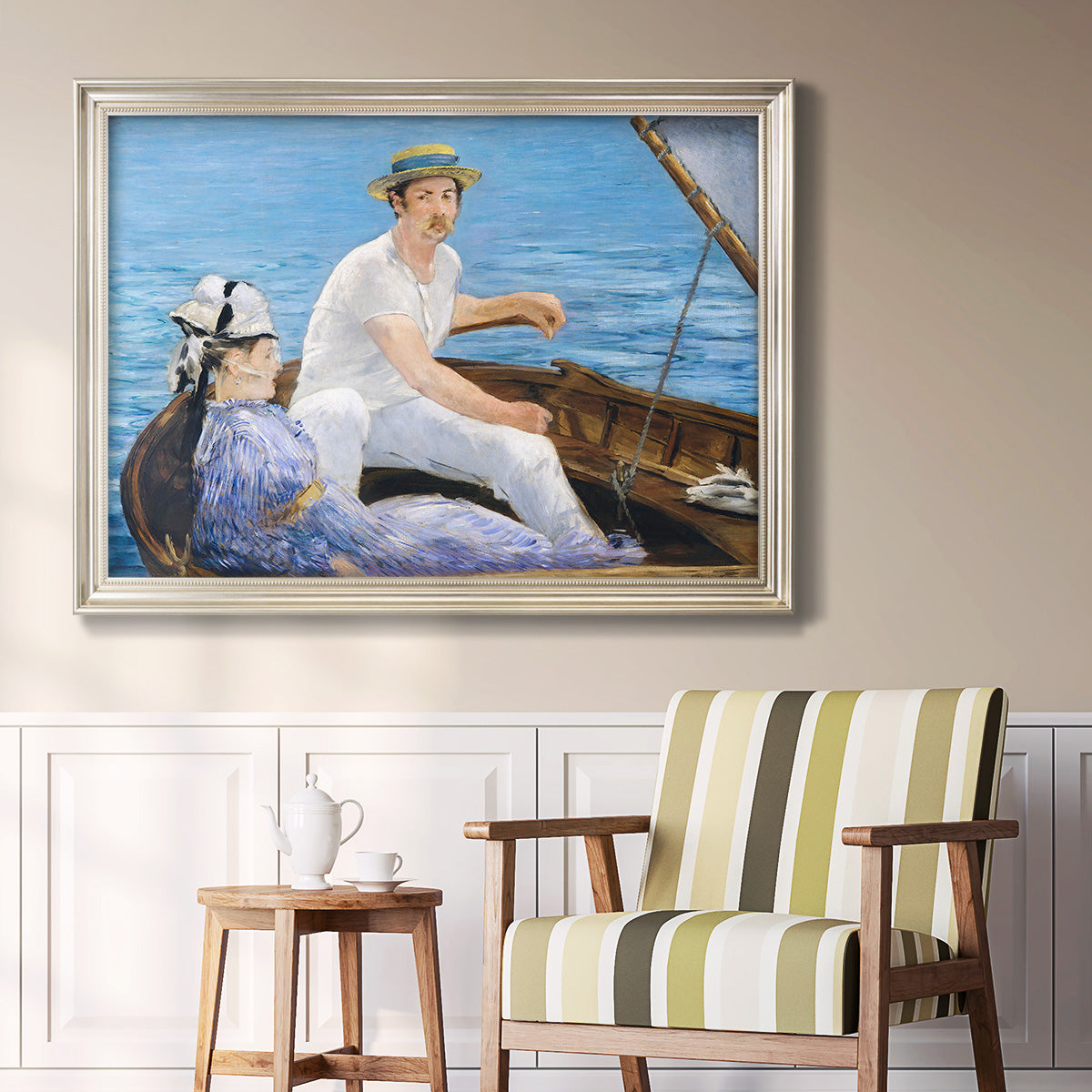 Impressionist leisure boating scene by Édouard Manet in an ornate champagne frame displayed in a light-toned interior setting.