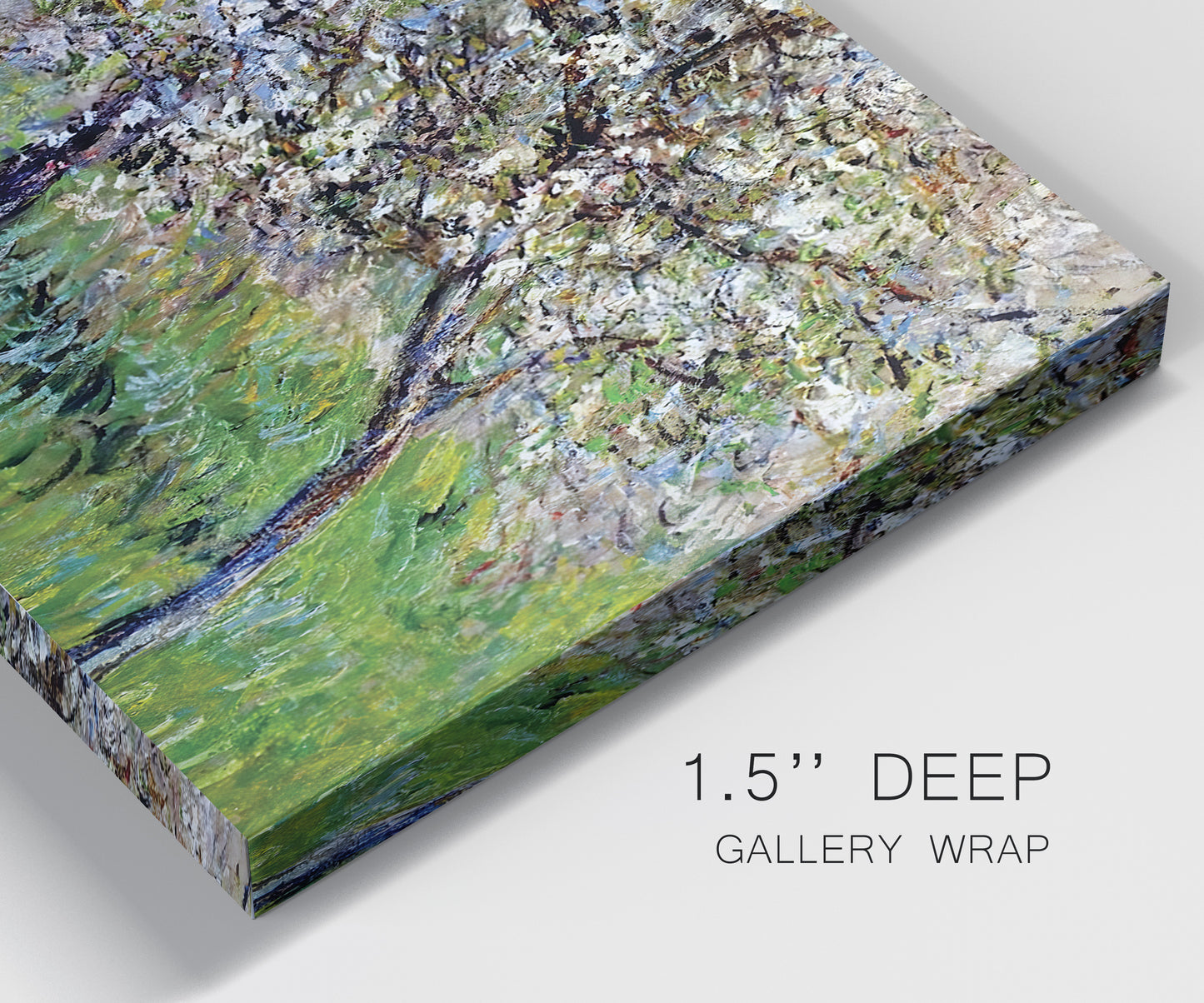 Close-up view of wrapped canvas corner featuring apple trees blooming beside water.