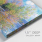 Close-up view of wrapped canvas corner featuring wide river landscape.