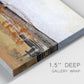 Close-up view of wrapped canvas corner featuring abstract bridge landscape in ochre.