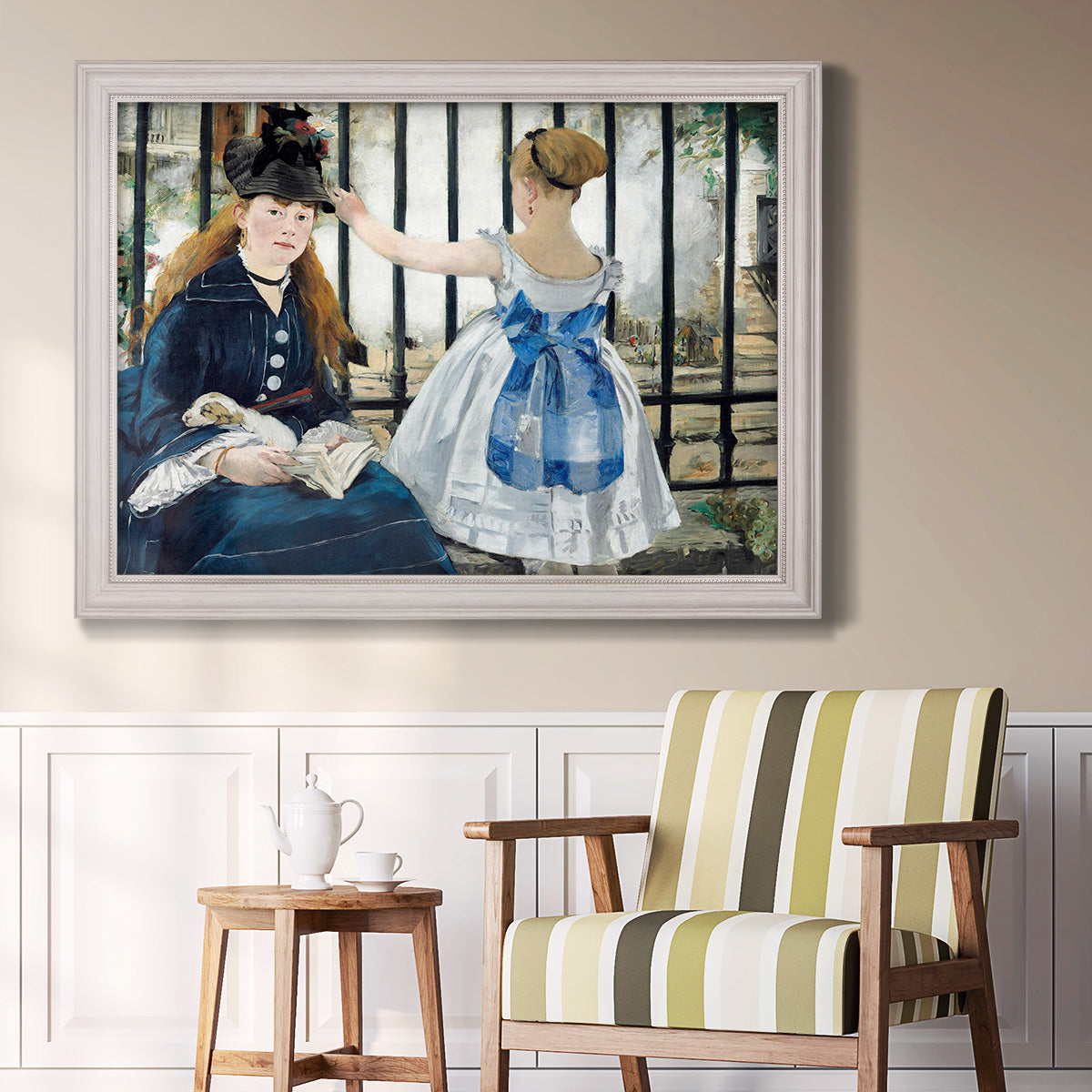 Impressionist urban scene near a railway by Édouard Manet in an ornate weathered white frame displayed in a light-toned interior setting.