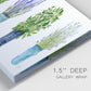 Close-up view of wrapped canvas corner featuring minimal monochrome abstract forms.
