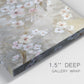 Close-up view of wrapped canvas corner featuring early spring blossoms in soft tones.