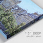 Close-up view of wrapped canvas corner featuring gothic church within city setting.