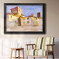 Impressionist Italian village scene by John Singer Sargent in an ornate black frame with gilded inner detail displayed in a light-toned interior setting.