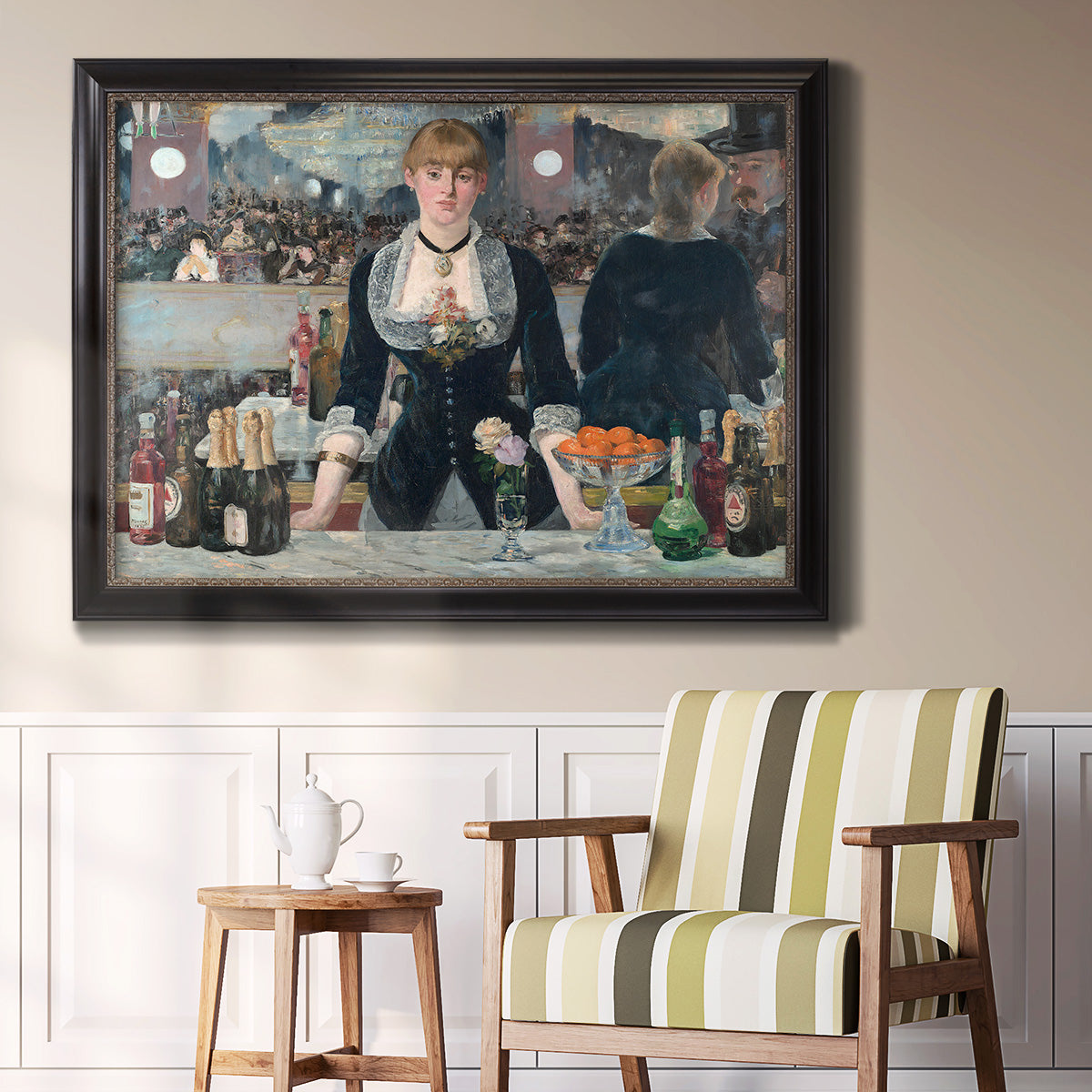 Iconic impressionist café bar scene by Édouard Manet in an ornate black frame with gilded inner detail displayed in a light-toned interior setting.