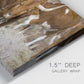 Close-up view of wrapped canvas corner featuring longhorn cattle standing together.