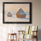 Impressionist winter haystack scene by Claude Monet in an ornate black frame with gilded inner detail displayed in a light-toned interior setting.