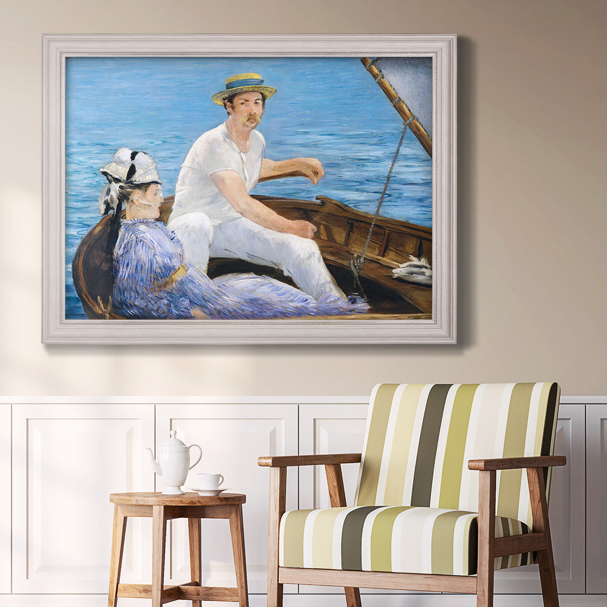 Impressionist leisure boating scene by Édouard Manet in an ornate weathered white frame displayed in a light-toned interior setting.