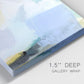 Close-up view of wrapped canvas corner featuring soft abstract spring watercolor tones.