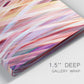 Close-up view of wrapped canvas corner featuring layered modern abstract color ribbons.