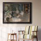 Impressionist backstage ballet scene by Edgar Degas in an ornate black frame with gilded inner detail displayed in a light-toned interior setting.