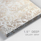 Close-up view of wrapped canvas corner featuring ornamental damask abstract pattern.