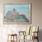 Impressionist coastal building landscape by Claude Monet in an ornate champagne frame displayed in a light-toned interior setting.