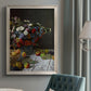 Impressionist floral still life painting by Claude Monet in an {frame_style_descriptor} displayed in a neutral interior setting.