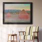 Impressionist haystack series landscape by Claude Monet in an ornate black frame with gilded inner detail displayed in a light-toned interior setting.