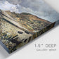 Close-up view of wrapped canvas corner featuring sunset beach with glowing sky.