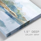 Close-up view of wrapped canvas corner featuring flowing blue abstract watercolor.