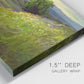 Close-up view of wrapped canvas corner featuring winding path through rolling hills.