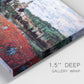 Close-up view of wrapped canvas corner featuring poppy field beside village landscape.