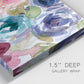 Close-up view of wrapped canvas corner featuring soft floral watercolor composition.