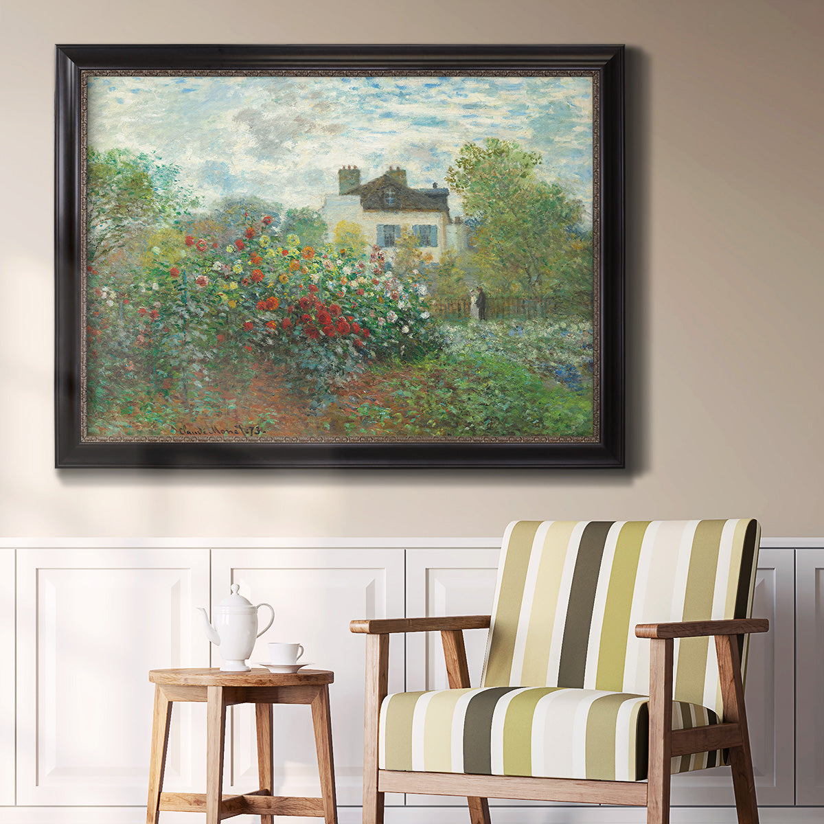 Impressionist garden landscape at Argenteuil by Claude Monet in an ornate black frame with gilded inner detail displayed in a light-toned interior setting.
