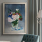 Impressionist floral still life painting by Claude Monet in an {frame_style_descriptor} displayed in a neutral interior setting.