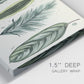 Close-up view of wrapped canvas corner featuring botanical palm leaf illustration.