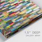 Close-up view of wrapped canvas corner featuring colorful confetti style abstraction.