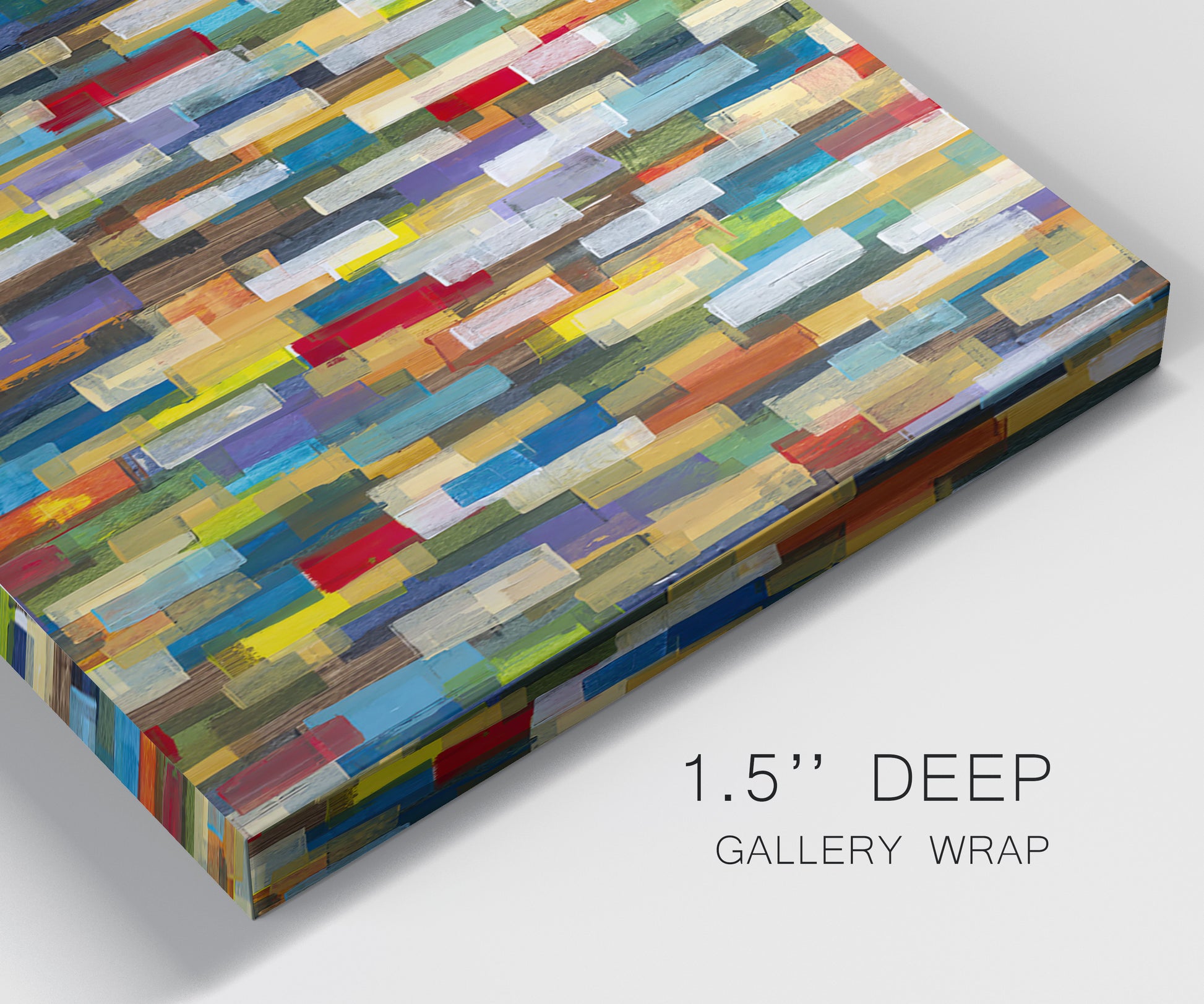 Close-up view of wrapped canvas corner featuring colorful confetti style abstraction.