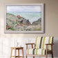 Impressionist coastal watch cabin scene by Claude Monet in an ornate weathered white frame displayed in a light-toned interior setting.