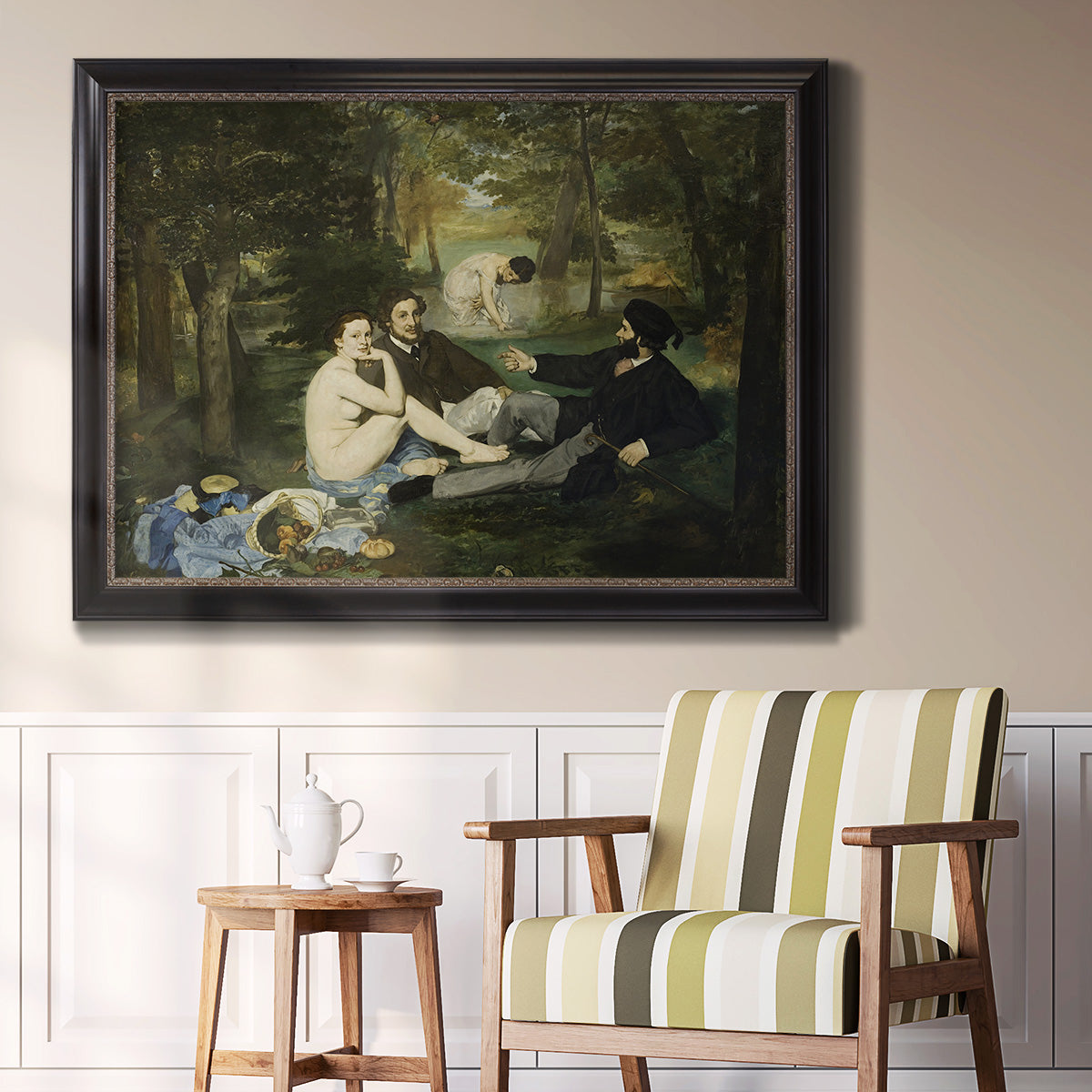 Groundbreaking impressionist picnic scene by Édouard Manet in an ornate black frame with gilded inner detail displayed in a light-toned interior setting.