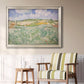 Impressionist countryside landscape near Auvers by Vincent van Gogh in an ornate champagne frame displayed in a light-toned interior setting.