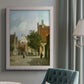 Rustic European street scene painting by Adriaan Eversen in an {frame_style_descriptor} displayed in a neutral interior setting.