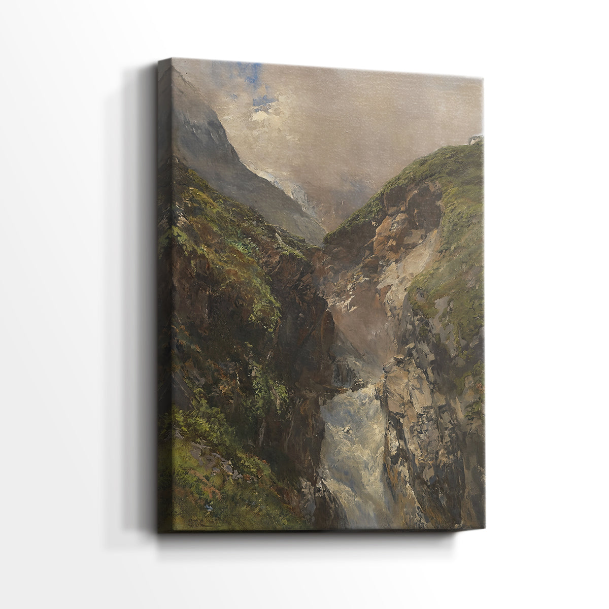Side view of a canvas art print of a natural scene with flowing water and towering cliffs, showing gallery-wrapped depth.